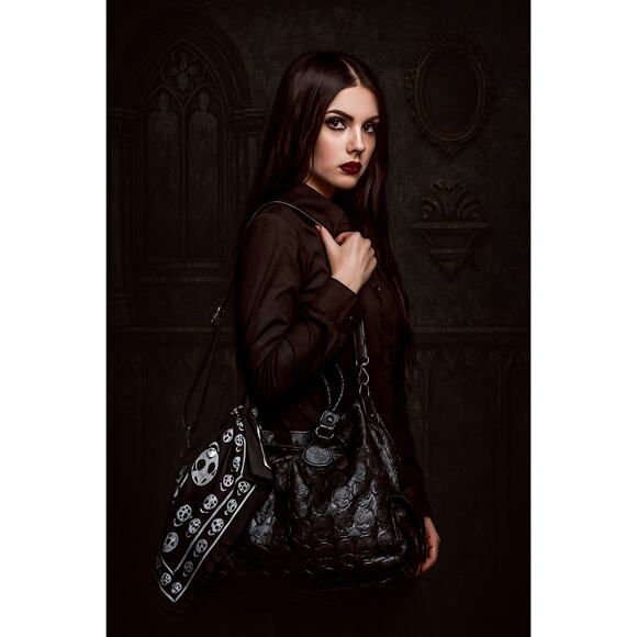 black faux-leather handbag with a textured embossed skull pattern - Picture 1 of 6